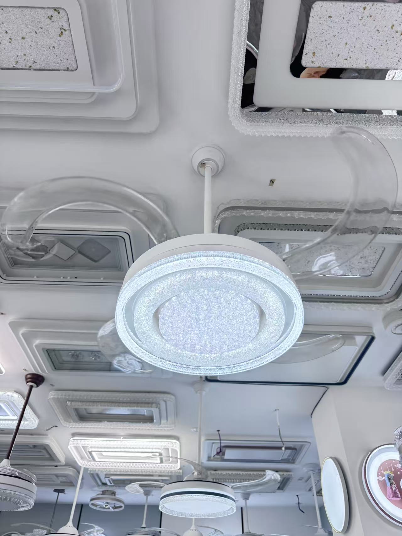 Ceiling lights installed above customers in the Guzhen showroom