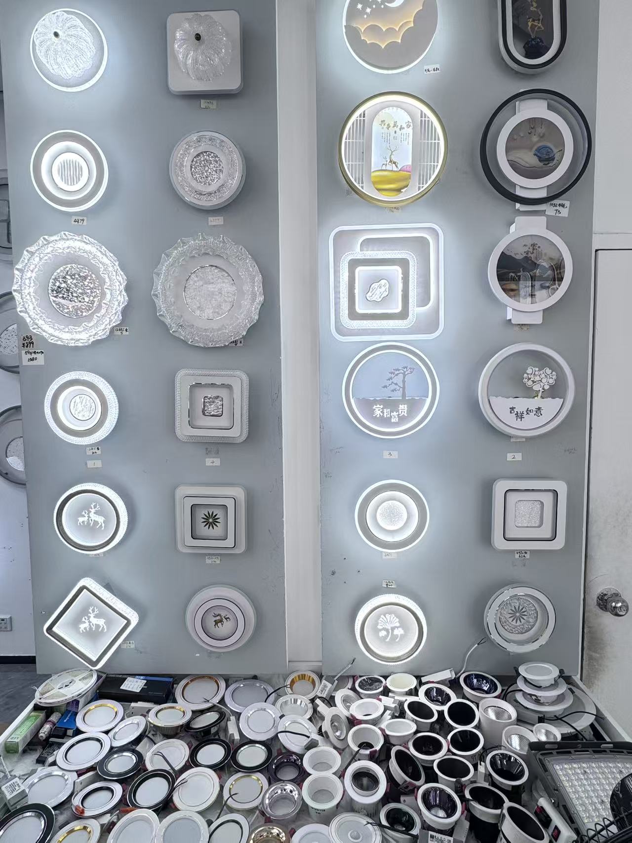 Ceiling-light samples and downlight components in the FIFTH & BEAM Guzhen showroom